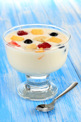 Delicious yogurt with fruit on table close-up