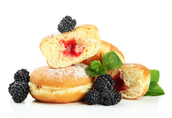 Tasty donuts with berries, isolated on white