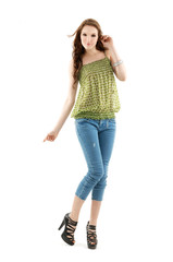 Full body beautiful woman in jeans posing in studio