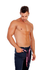 Fototapeta premium Men with perfect abs measuring his waist