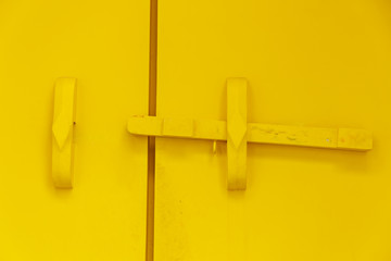 Yellow wooden door bar