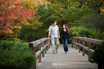 Fototapeta premium Loving couple walking in the autumn park
