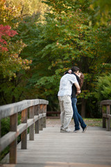 Fototapeta na wymiar Loving couple walking in the autumn park