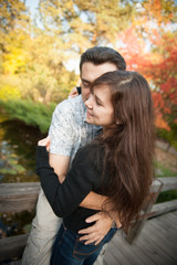 Loving couple embracing in autumn park