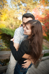 Fototapeta premium Loving couple embracing in autumn park