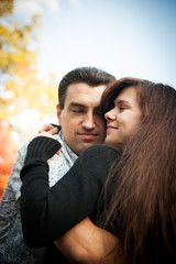 Loving couple embracing in autumn park