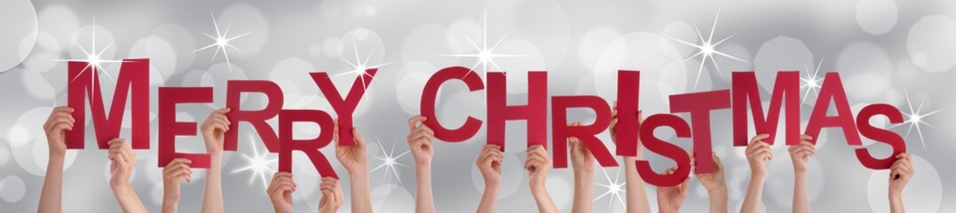 Hands Holding Merry Christmas