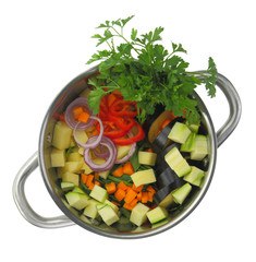 Fresh cut ingredients for vegetable soup in a pot