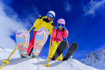 Ski and winter fun - skiers enjoying ski vacation - obrazy, fototapety, plakaty