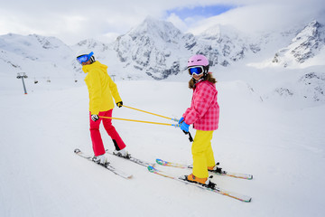 Skiing, skiers on ski run - child skiing , ski lesson