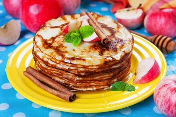 Delicious pancakes, honey apples and cinnamon