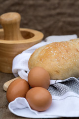 Fototapeta na wymiar Loaf of sourdough bread in rustic kitchend setting