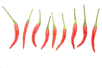 Fotobehang group of red chilies on white background © torsakarin