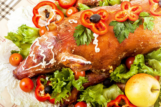 Christmas Roast Suckling Pig On Banquet Table