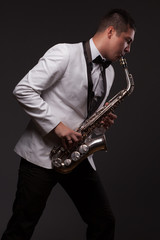 Obraz na płótnie Canvas Sax player playing modern music
