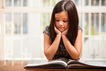 Cute girl reading a storybook