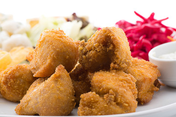 Chicken with salad, french fries and pasta on the side