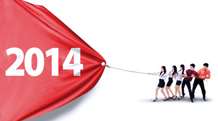 Business teamwork pull number of 2014