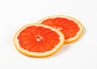 Obraz na płótnie Canvas Slices of red grapefruit