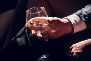 Man hand holding a glass of champagne