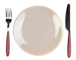 Knife, color plate and fork, isolated on white