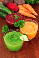 Fresh vegetable juices on table close-up