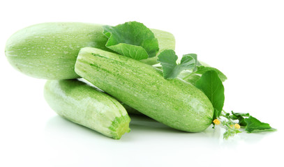 Raw zucchini with leaves, isolated on white