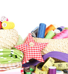 Wicker baskets with accessories for needlework isolated on