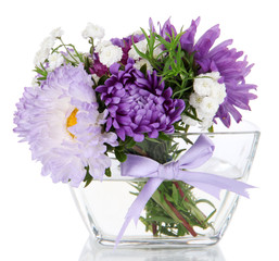 Beautiful bouquet of bright flowers in glass vase, isolated