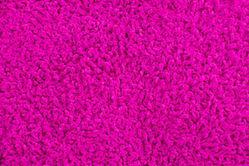 Fleecy pink pillow close-up background