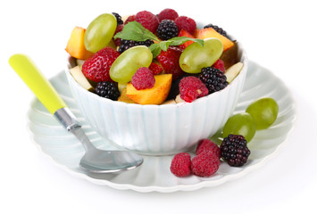 Fruit salad in bowl, isolated on white