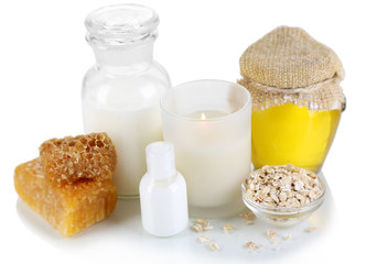 Honey and milk spa with oils and honey isolated on white