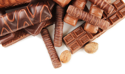 Delicious chocolate bars with nuts close up