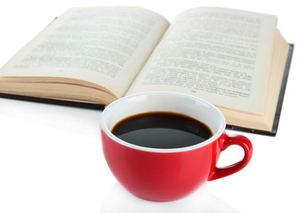 Cup of coffee and book isolated on white