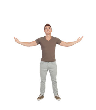 Casual young man looking up with arms extended