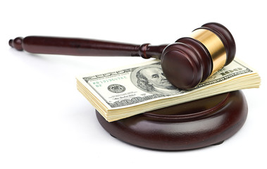 Law gavel on a stack of American money. - 56799831