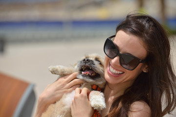 happy young woman with puppy have fun