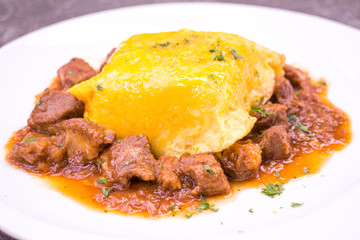 Pork goulash with egg on rice