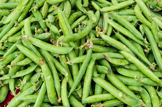 Green peas in pods at market