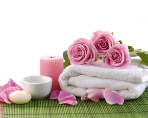 rose petals and towel on green mat