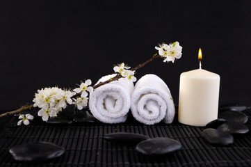 Spa feeling with candle ,cherry ,towel ,pebbles