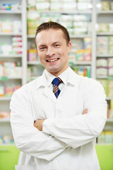 Man pharmacy chemist in drugstore