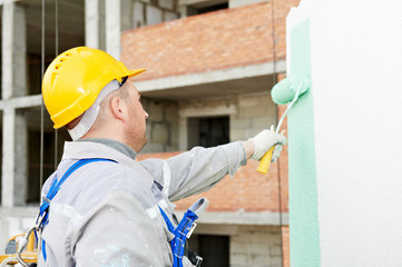 builder facade painter at work