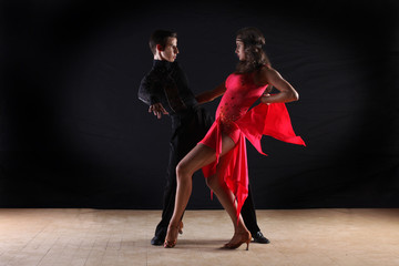 Fototapeta premium Latino dancers in ballroom isolated on black background