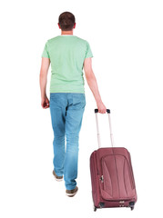 back view of walking  man  with suitcase.