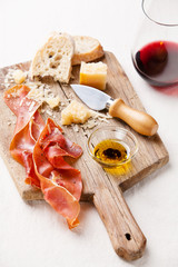 Prosciutto, cheese, bread and wine