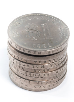 Old Malaysia Coin stacked on a white background