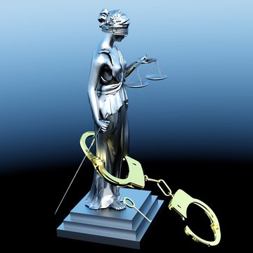 Lady of Justice  statue and handcuffs