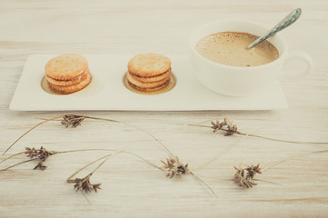 Fresh coffee in cup with cookie and honey