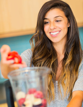 Woman Making Fresh Fruit Smoothie